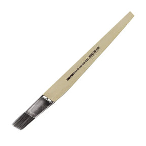 Paintbrush with a wooden handle on a white background