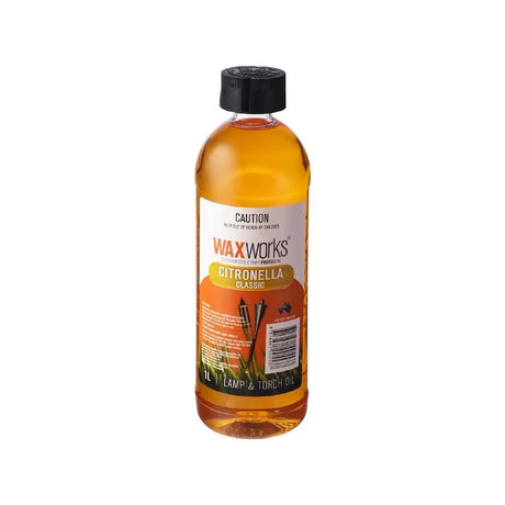 Bottle of Waxworks Citronella oil on a white background