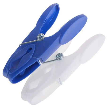 Two clothespins, one blue and one white, on a white background