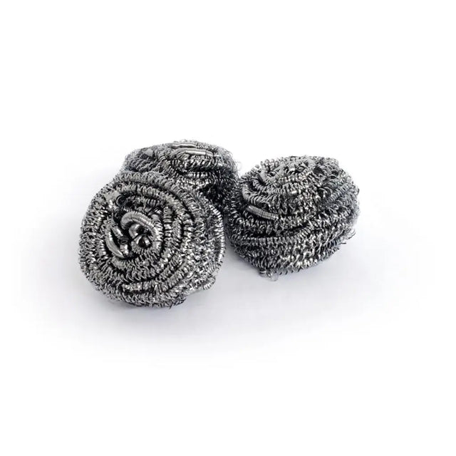 Three metallic scrubber balls on a white background