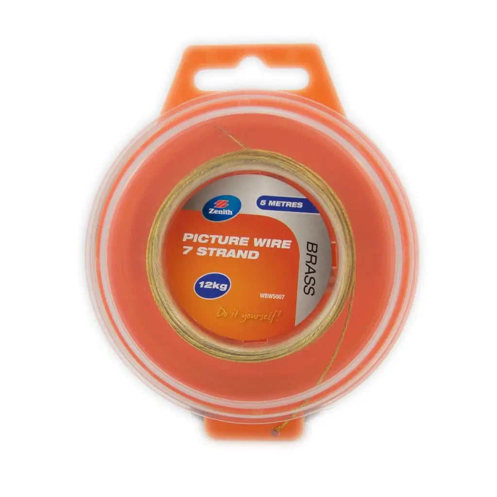 Spool of brass picture wire with orange packaging on a white background