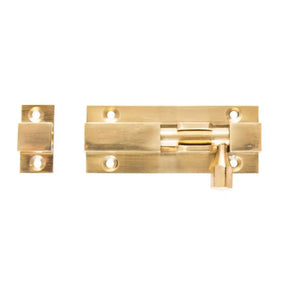 Gold metal latch on a white background