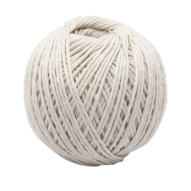 Ball of white twine on a white background