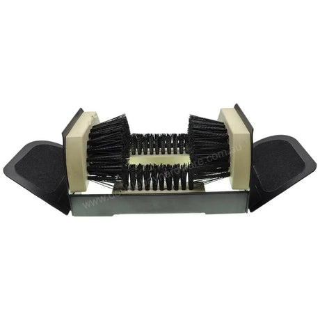 Cleaning brush with black bristles and beige handle on a white background