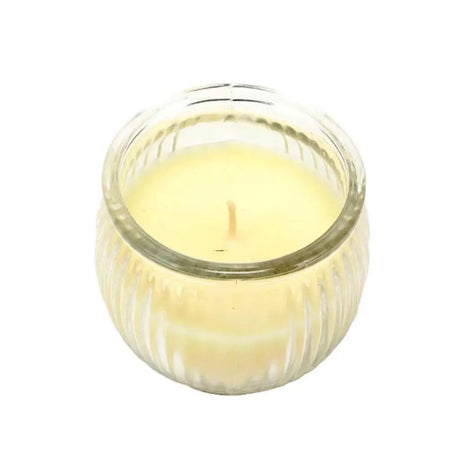 Candle in a glass jar with a white background
