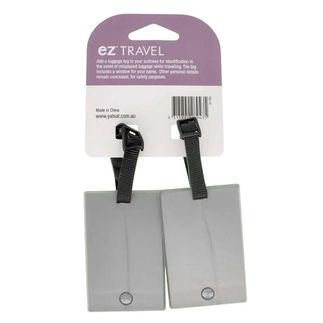 Two gray luggage tags with black straps on a purple ez Travel card against a white background.