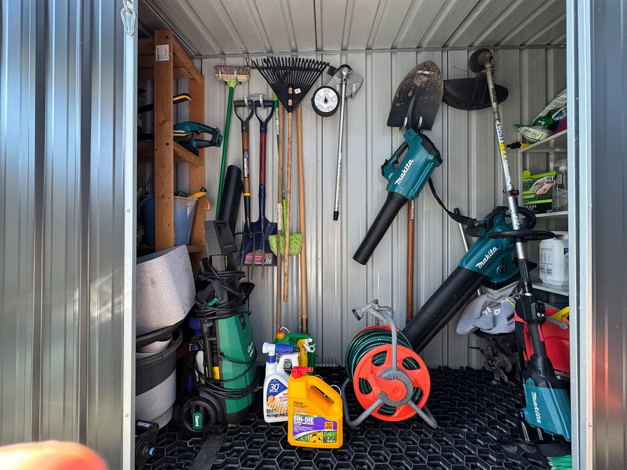 Garden tools and equipment stored in a shed