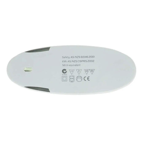 Round white device with safety certification labels on a white background