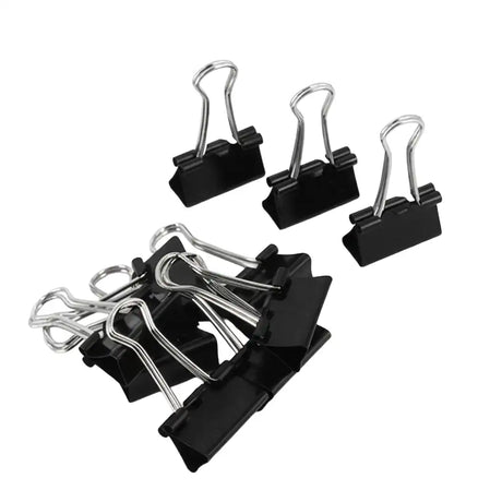 Set of black binder clips on a white background