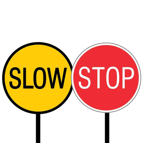 Yellow 'SLOW' sign and red 'STOP' sign on a white background