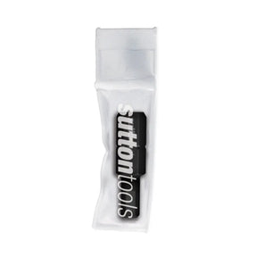 A SUTTON TOOLS brand black and white logo decal or patch inside a clear plastic protective sleeve, shown on a plain white background.