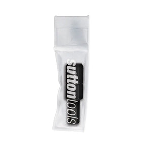 A SUTTON TOOLS brand black and white logo decal or patch inside a clear plastic protective sleeve, shown on a plain white background.